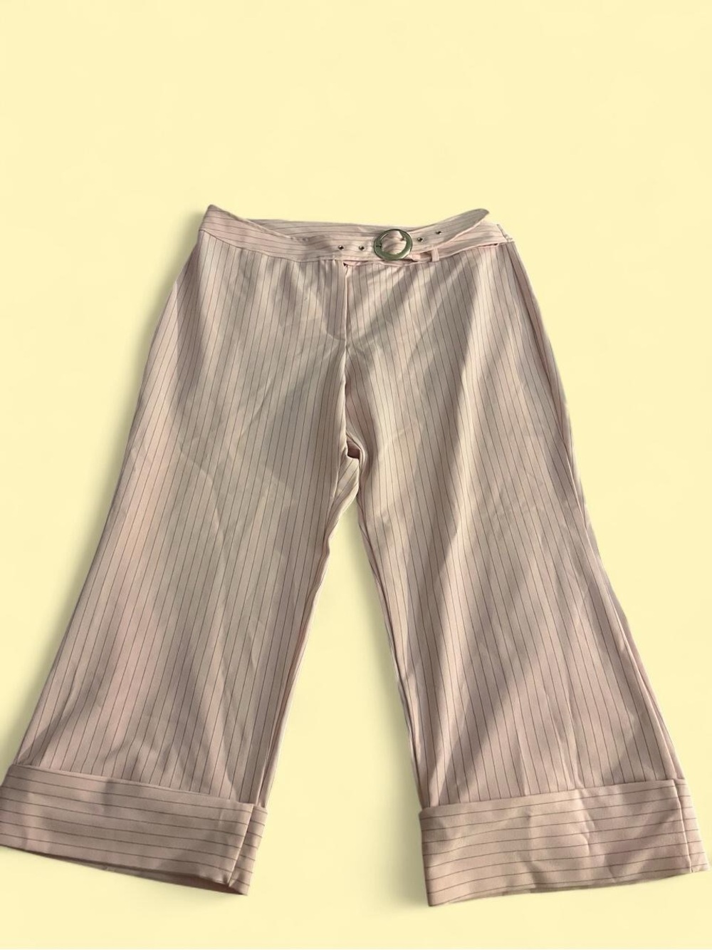 Pink pinstriped wide leg capris with a silver belt